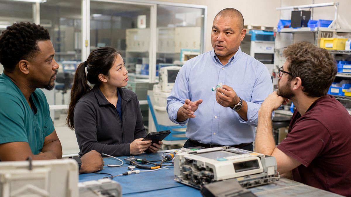 Devin leads a clinical engineering briefing Devin leads a clinical engineering briefing
