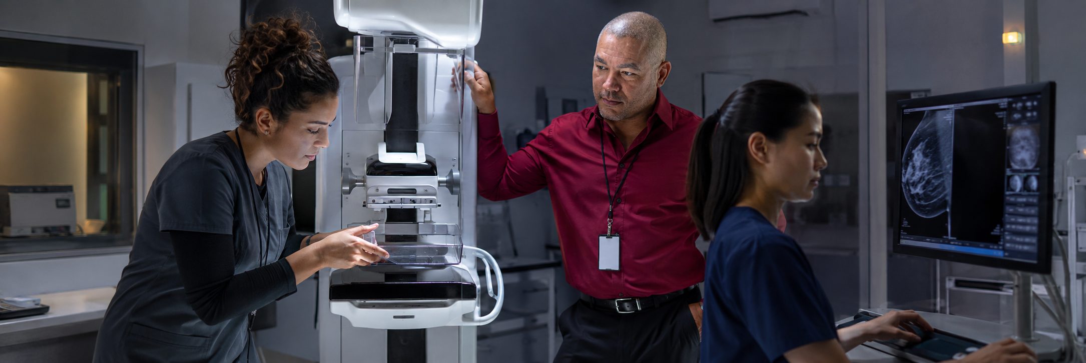 Operating room surgical light inspection and service | BiomedRx HTM services HTM technicians inspecting operating room surgical lights during scheduled service